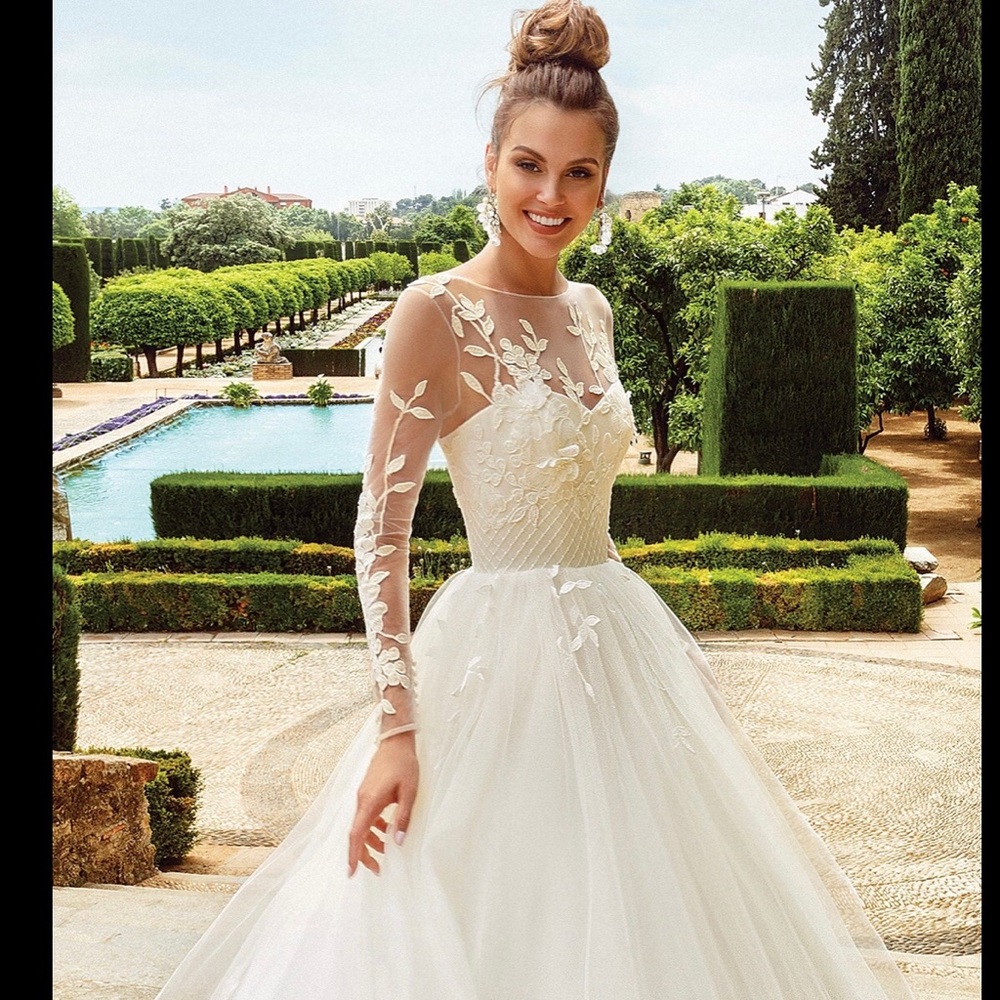 Sheer long sleeve floral ballgown wedding dress